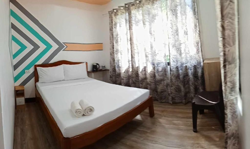 Postel nebo postele na pokoji v ubytování Vali-Joe Travel Lodge
