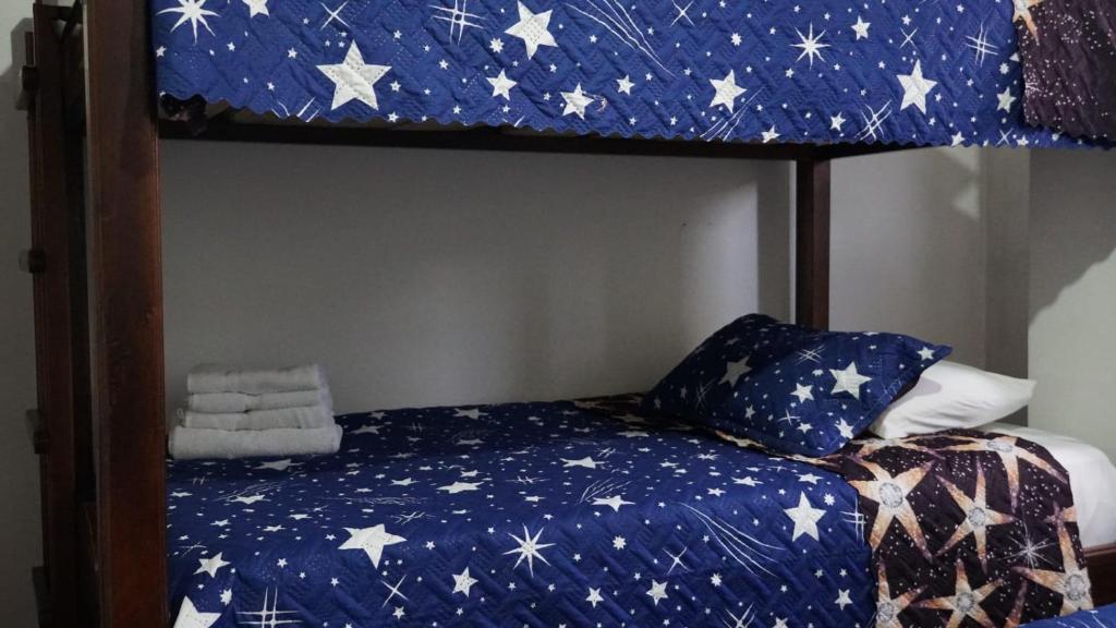 Letto o letti in una camera di Hostal Palmas De Cocora
