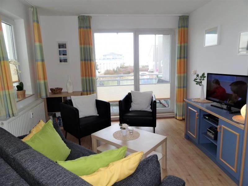 a living room with a couch and a tv at Yachthafenresidenz-Wohnung-8203-851 in Kühlungsborn