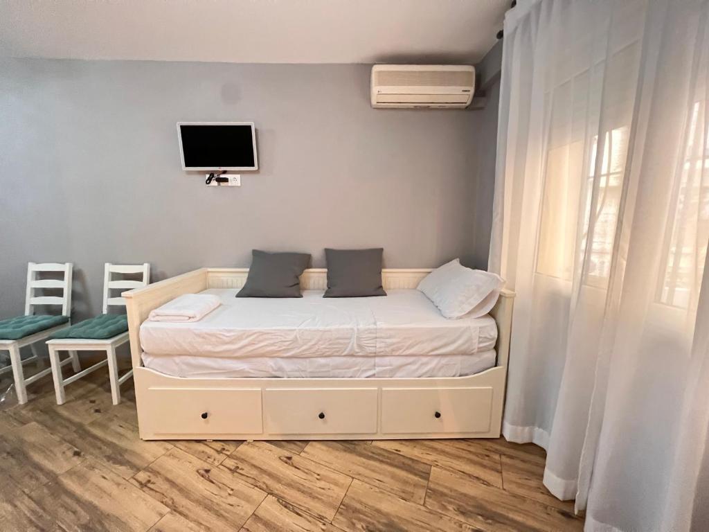 Posteľ alebo postele v izbe v ubytovaní Nuestra Casita de Marmoles Parking Incluido 2 bicis gratis