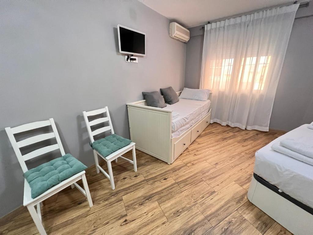 Posteľ alebo postele v izbe v ubytovaní Nuestra Casita de Marmoles Parking Incluido 2 bicis gratis