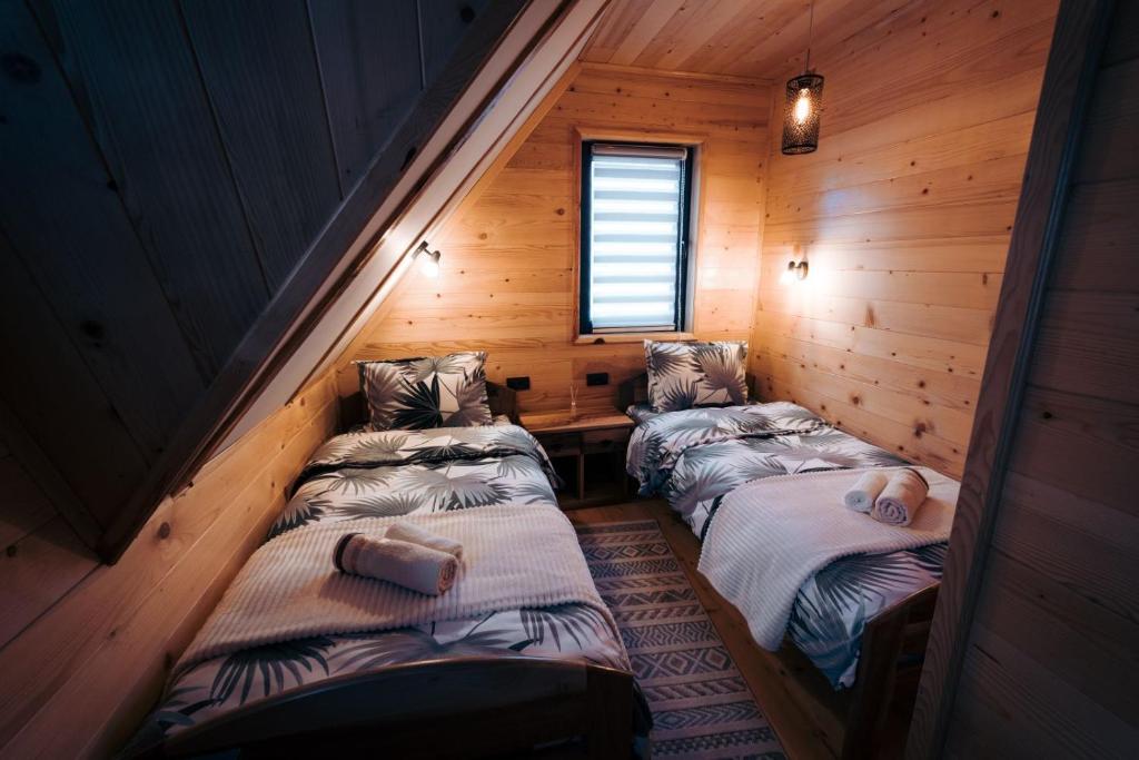 Postel nebo postele na pokoji v ubytování Vila Helena -Apartman 3