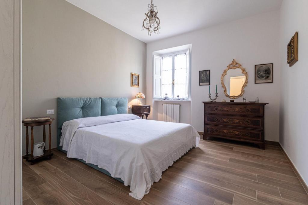 Postel nebo postele na pokoji v ubytování La casa del pittore Squillantini suite