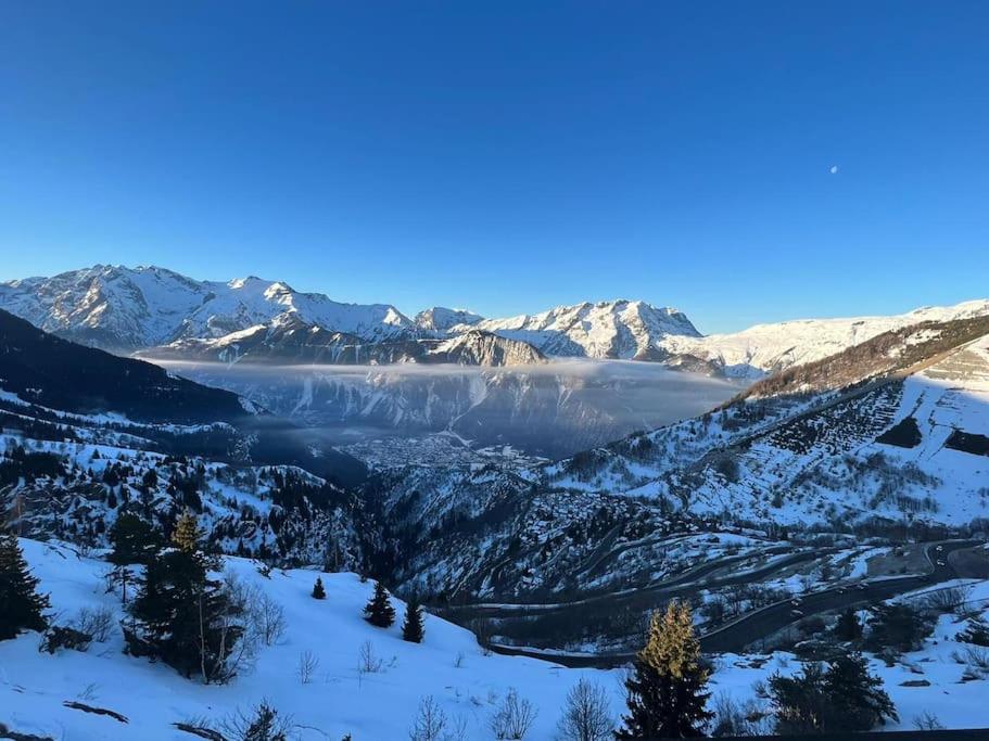 a view of a valley covered in snow at Stunning apartment with breathtaking view! in LʼHuez