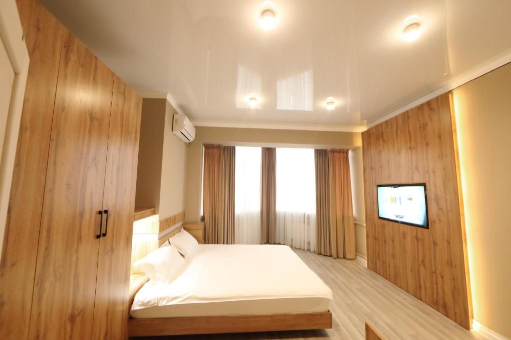 Cozy Hostel tesisinde bir odada yatak veya yataklar