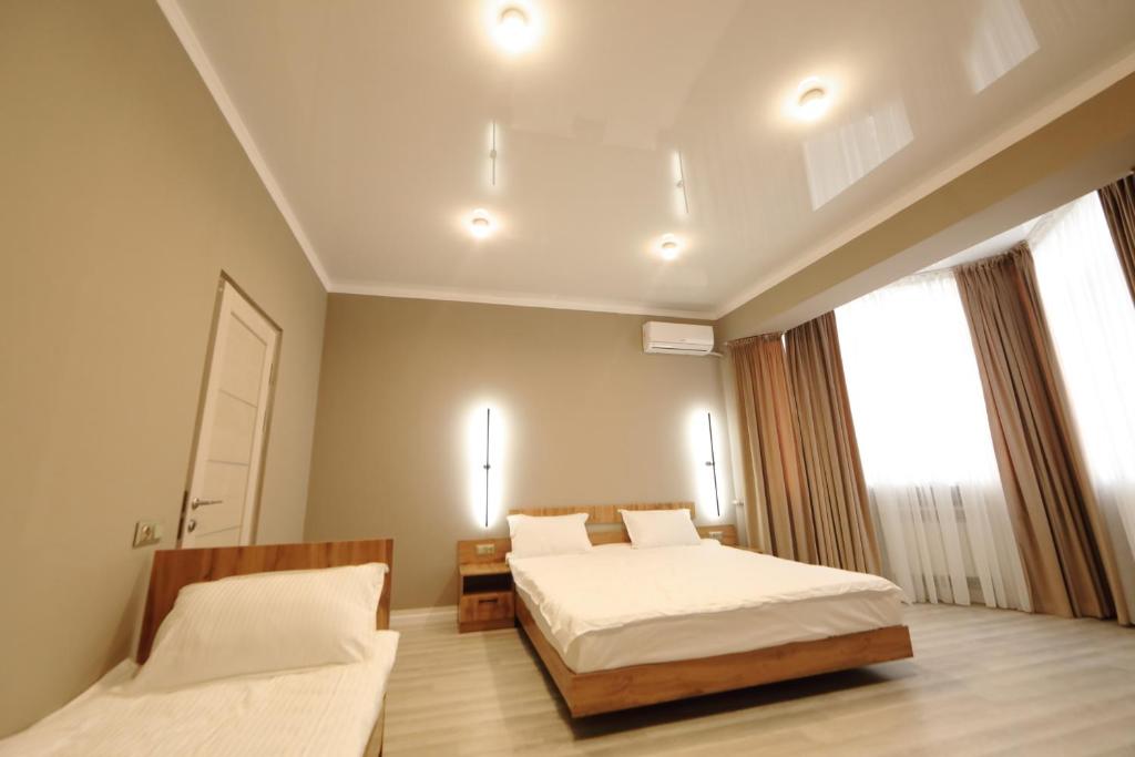 Postel nebo postele na pokoji v ubytování Cozy Hostel