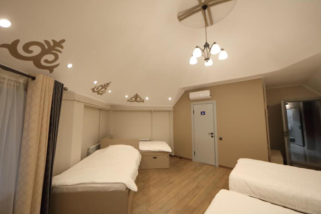 Postel nebo postele na pokoji v ubytování Cozy Hostel