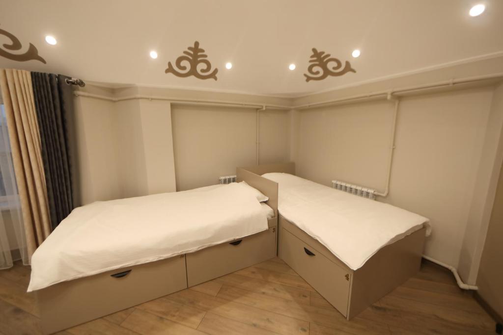 Postel nebo postele na pokoji v ubytování Cozy Hostel