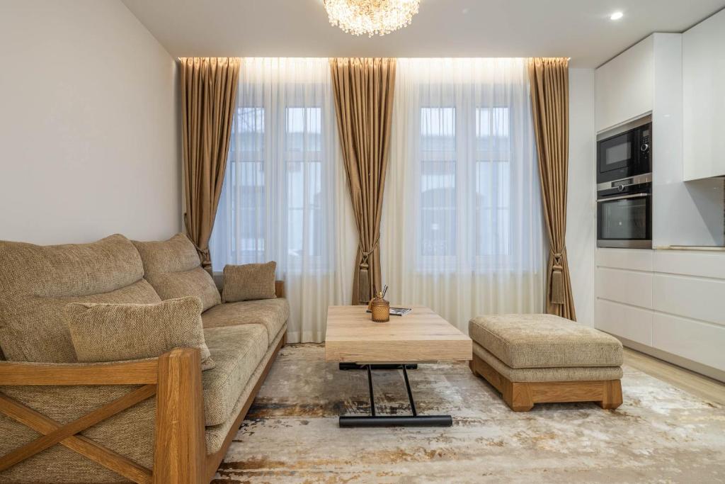 a living room with a couch and a chair at Brand new home in the center of the Old Town in Klaipėda