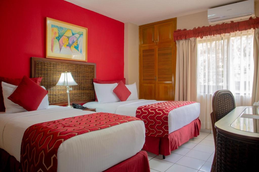 Postel nebo postele na pokoji v ubytování Aparthotel Guijarros