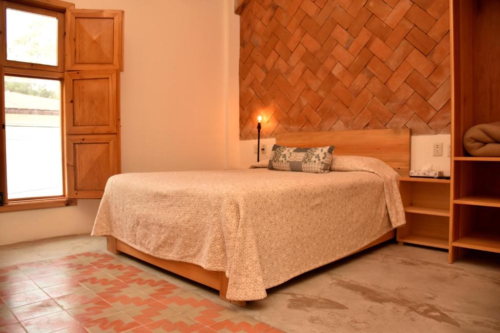 Ένα ή περισσότερα κρεβάτια σε δωμάτιο στο Mansion Primavera