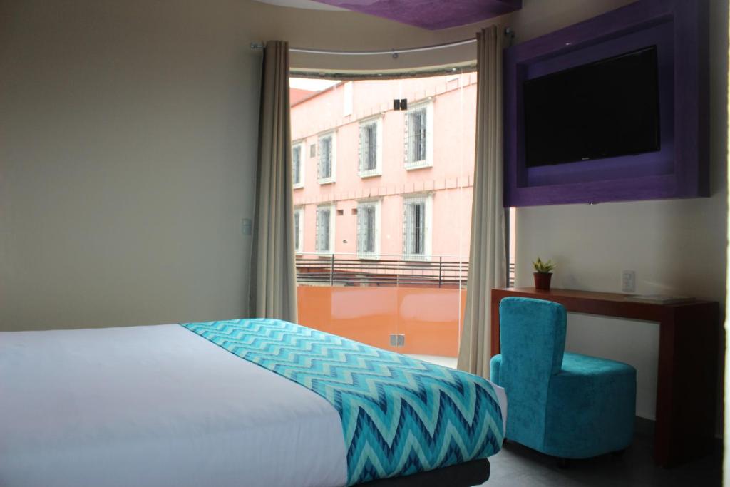Postel nebo postele na pokoji v ubytování Orizaba Inn