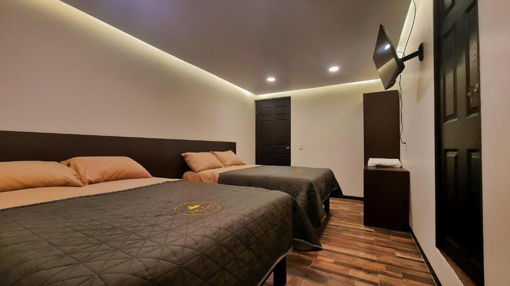 Postel nebo postele na pokoji v ubytování Jovis Hotel - Lujo Cultural