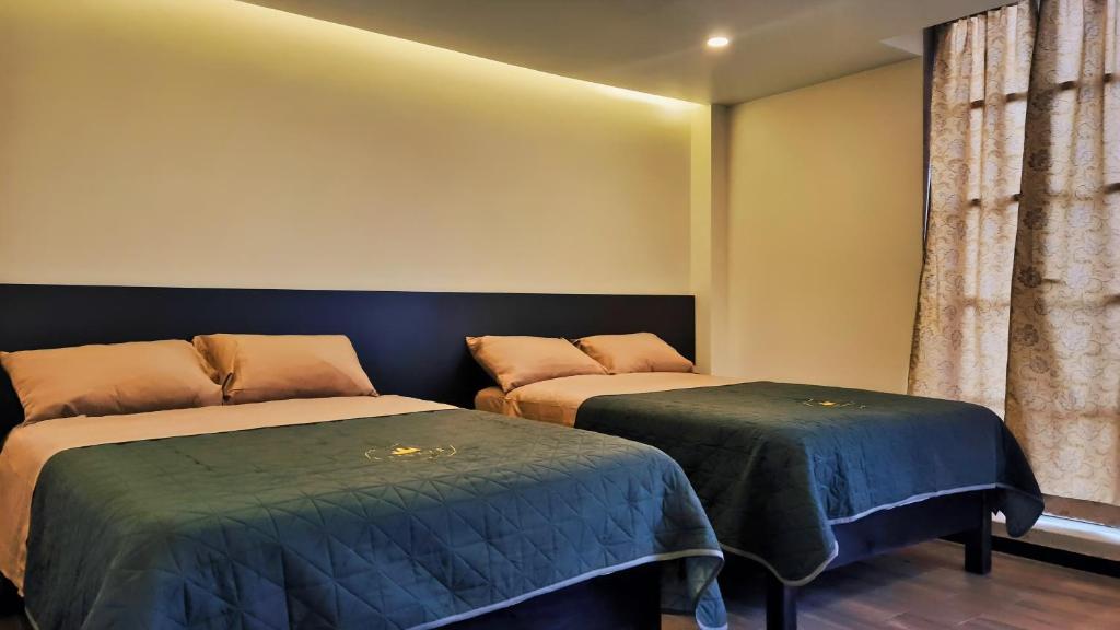 Postel nebo postele na pokoji v ubytování Jovis Hotel - Lujo Cultural
