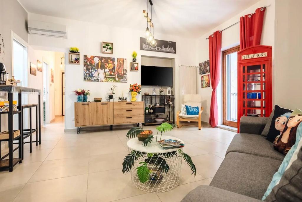 a living room with a couch and a table at Peri Peri House - Palermo Centro in Palermo