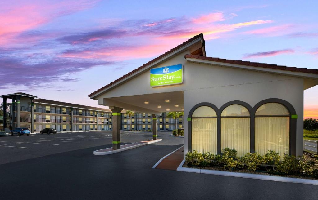 a rendering of the front of a hotel at SureStay Hotel by Best Western Clermont Theme Park West in Kissimmee