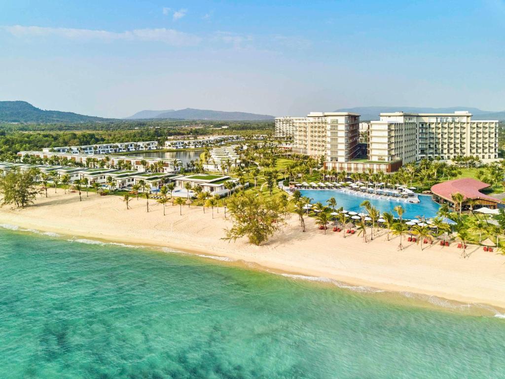 an aerial view of a resort on the beach at Mövenpick Resort Waverly Phu Quoc in Phu Quoc