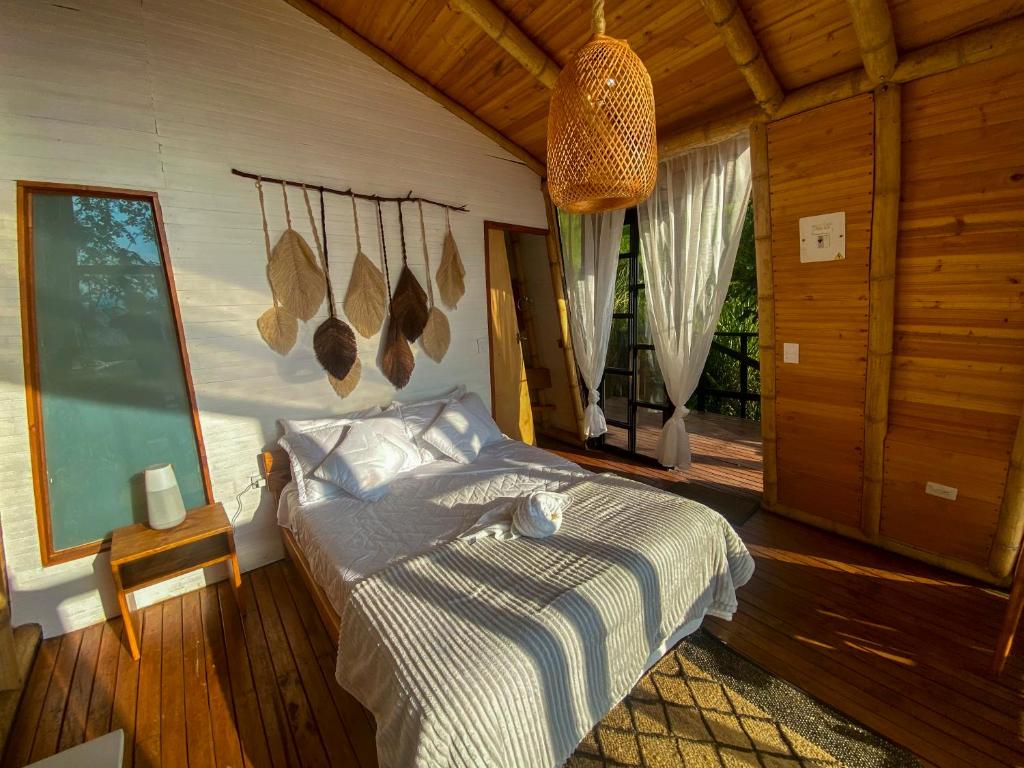 Postel nebo postele na pokoji v ubytování NaturalMente Glamping