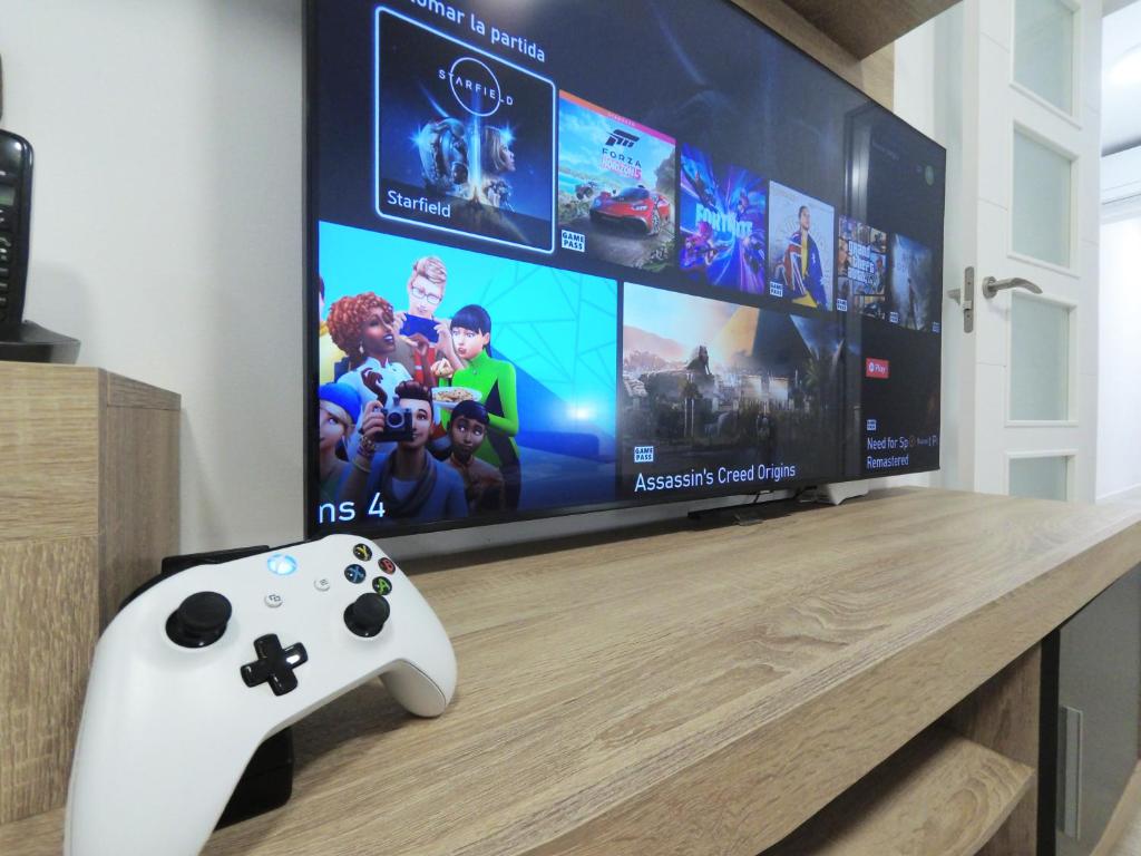 TV a/nebo společenská místnost v ubytování Apartamento New Tarraco