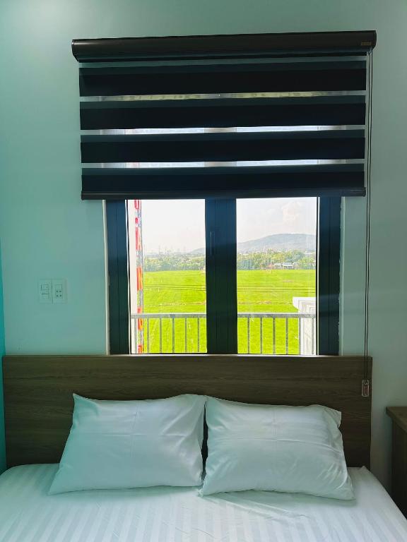Postel nebo postele na pokoji v ubytování Ruby Motel Bà Rịa