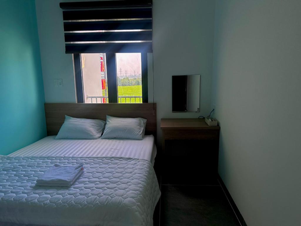 Postel nebo postele na pokoji v ubytování Ruby Motel Bà Rịa