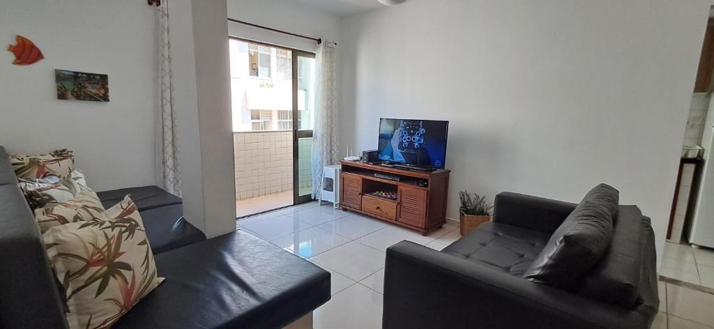 Μια τηλεόραση ή/και κέντρο ψυχαγωγίας στο Apto na Prainha a 4 minutos da Praia