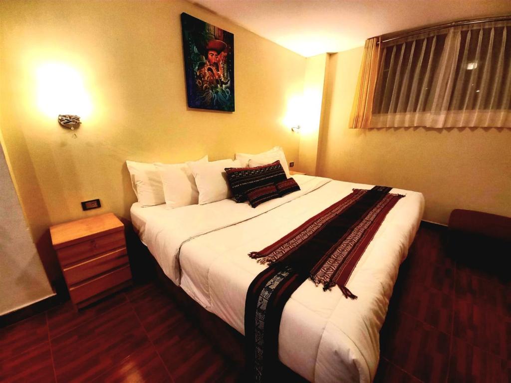 Postel nebo postele na pokoji v ubytování Hotel Humantay lodge Ollantaytambo