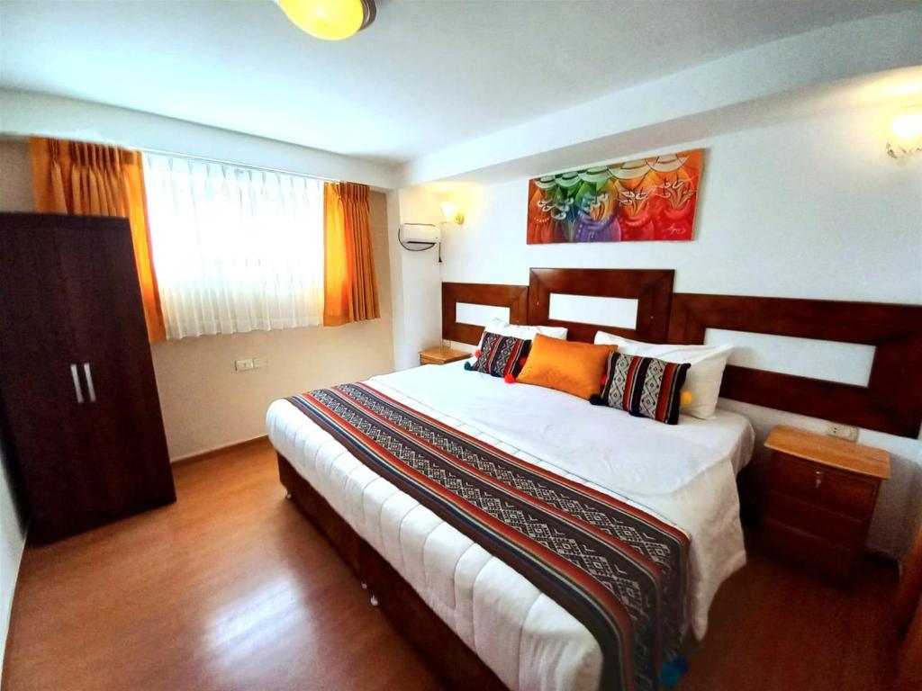 Postel nebo postele na pokoji v ubytování Hotel Humantay lodge Ollantaytambo
