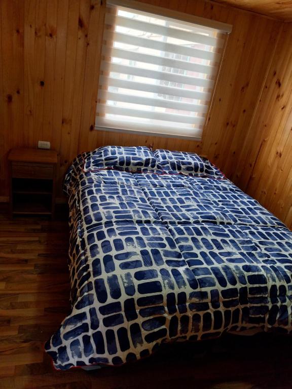 a bed in a room with a window at Cricri in Castro