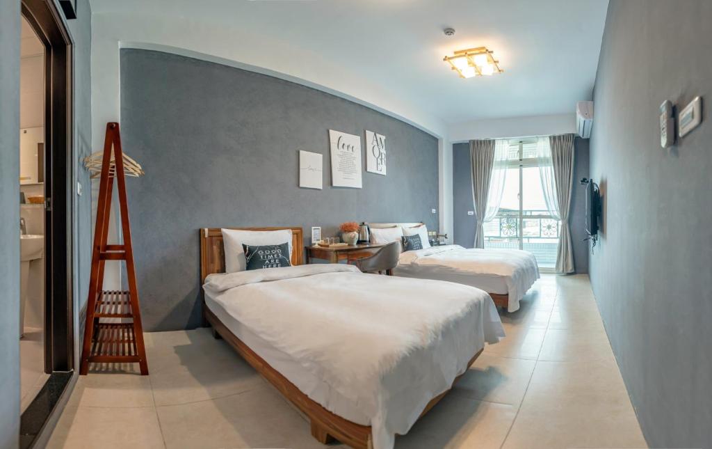 Postel nebo postele na pokoji v ubytování Ruisui Style B&B