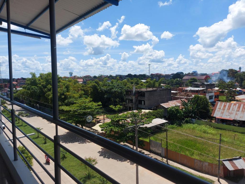 a view of a city from a balcony at Makasai Habitaciones in Puerto Maldonado