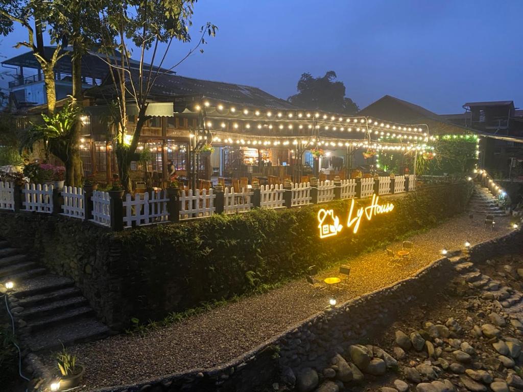 a building covered in lights with lights on it at Ly House in Sa Pa