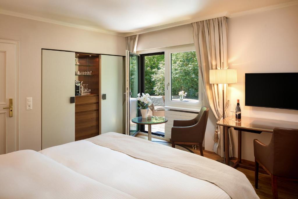 Postel nebo postele na pokoji v ubytování Park Hotel Sonnenhof - Relais & Châteaux