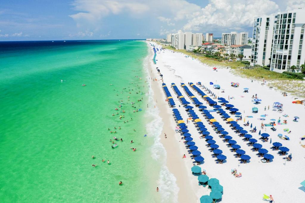 an aerial view of a beach with umbrellas and people at Pelican Beach Paradise! in Destin