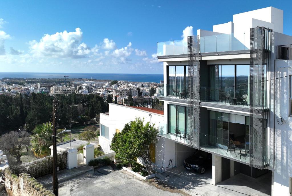 a building with a view of a city at Aeon Residences - In the heart of Paphos in Paphos City