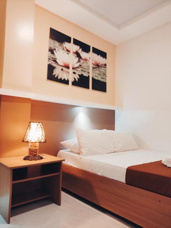 Postel nebo postele na pokoji v ubytování Aurelle Inn