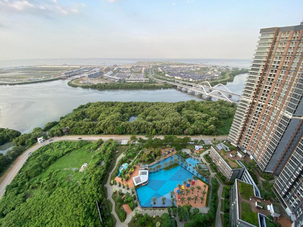 an aerial view of a building and a river at Comfort and Luxury Private Room at Goldcoast PIK in Jakarta