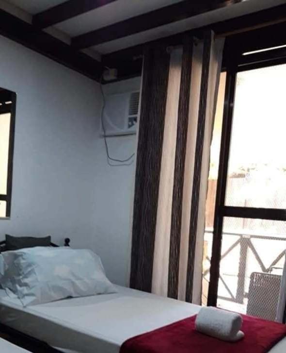 Voodi või voodid majutusasutuse Mannah Garden Staycation Place toas