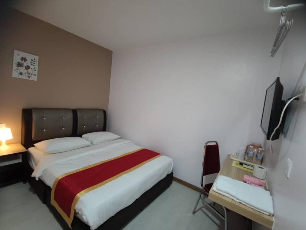 Postel nebo postele na pokoji v ubytování Hotel Ching Hua