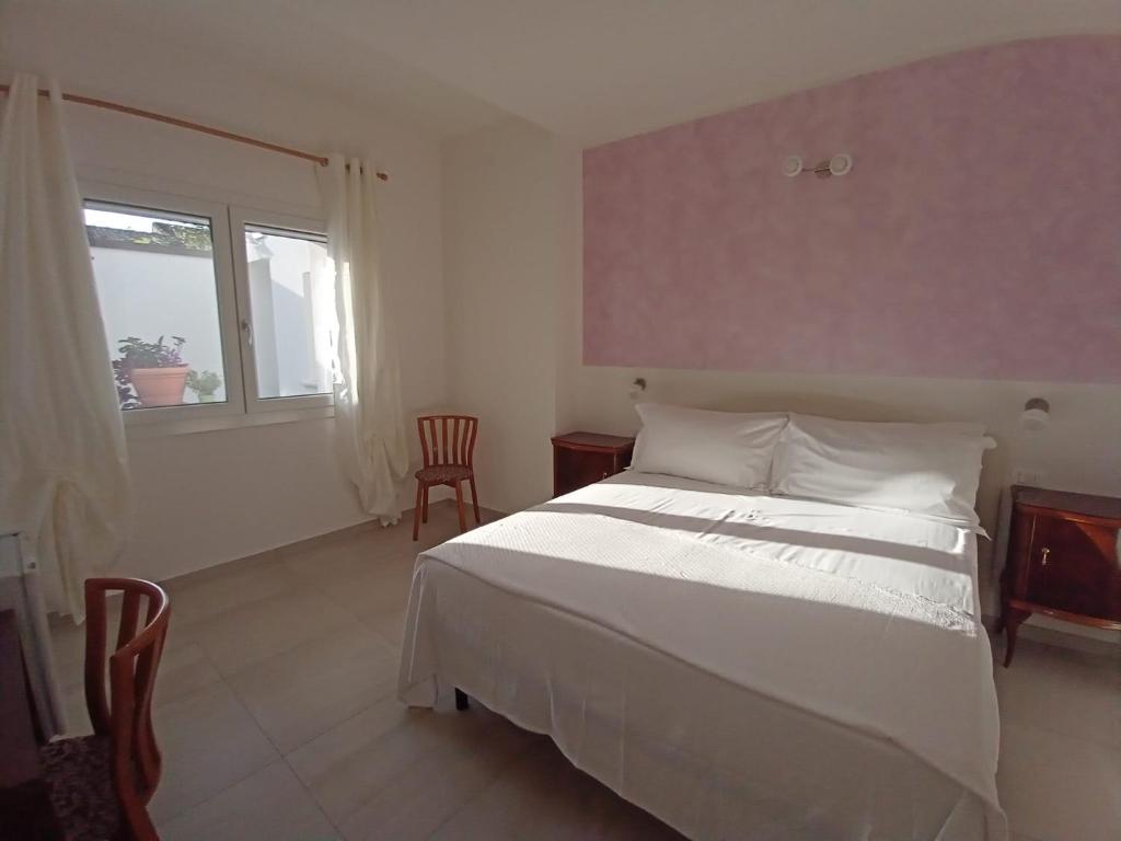 Postel nebo postele na pokoji v ubytování B&B Residenza Luciani Affittacamere