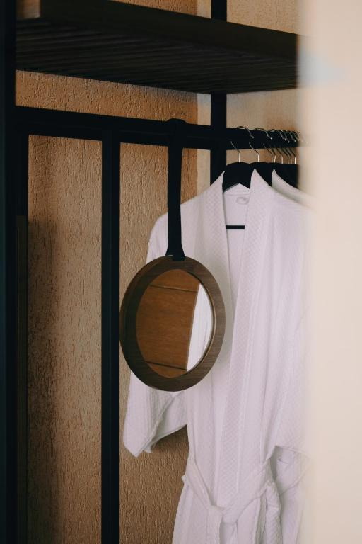 a group of white shirts hanging on a rack at The Funny Lion - Puerto Princesa in Puerto Princesa City