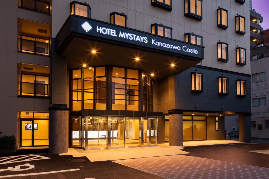 a hotel with a sign on the front of a building at HOTEL MYSTAYS Kanazawa Castle in Kanazawa