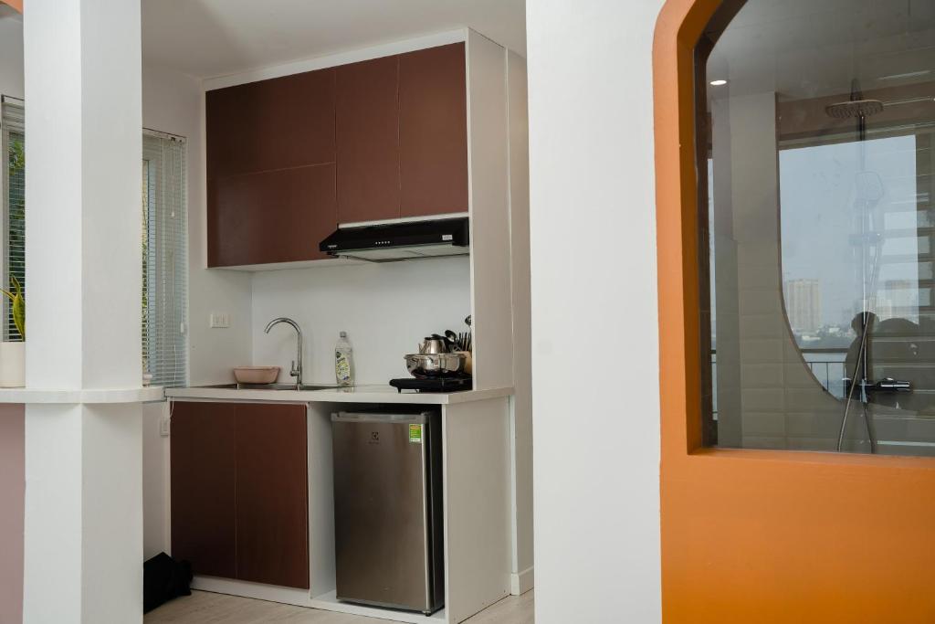 Kuchyň nebo kuchyňský kout v ubytování AimeeHouse - Trích Sài