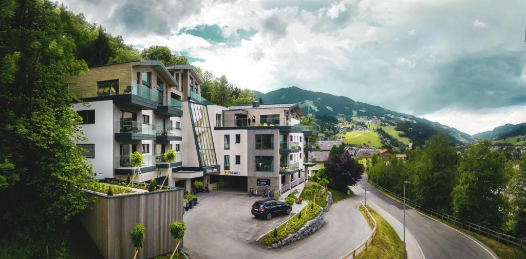 a view of a city with buildings and a street at Chalets Coburg in Schladming