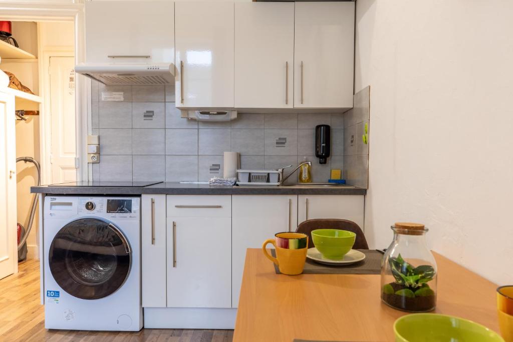 Kuchyň nebo kuchyňský kout v ubytování Résidence du Parc appartement calme
