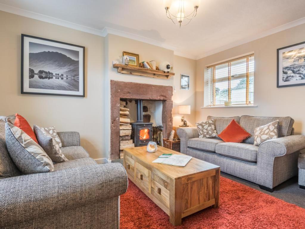 a living room with two couches and a fireplace at 3 Bed in Gosforth SZ064 in Gosforth