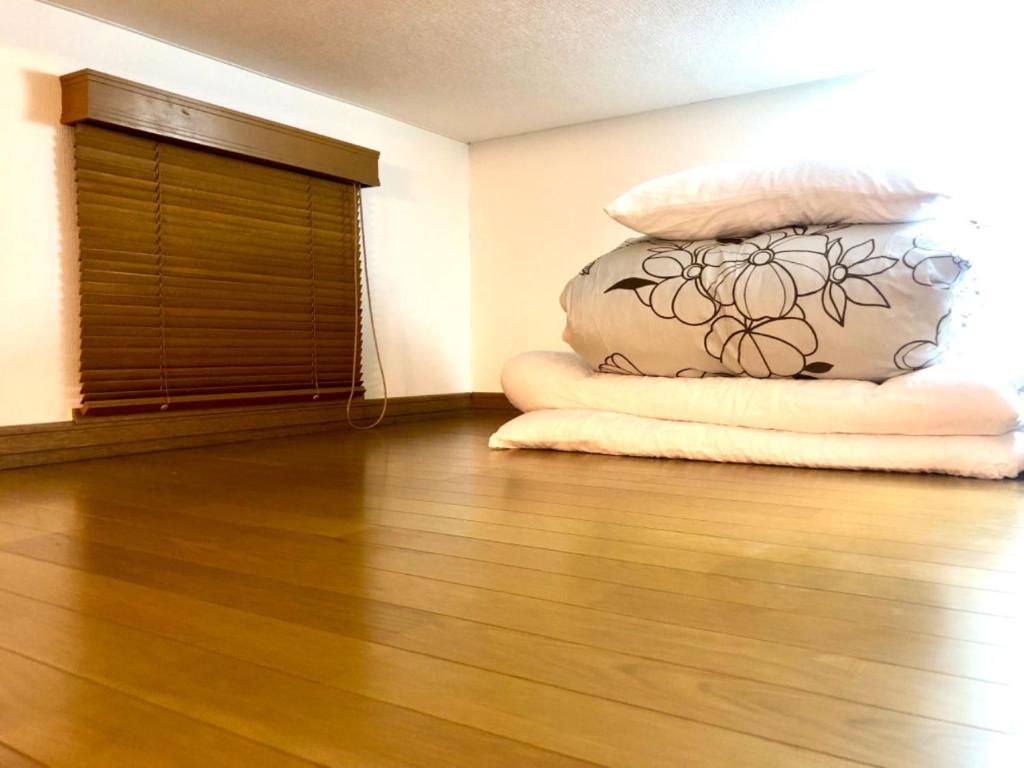 Postel nebo postele na pokoji v ubytování Aioi Lodge