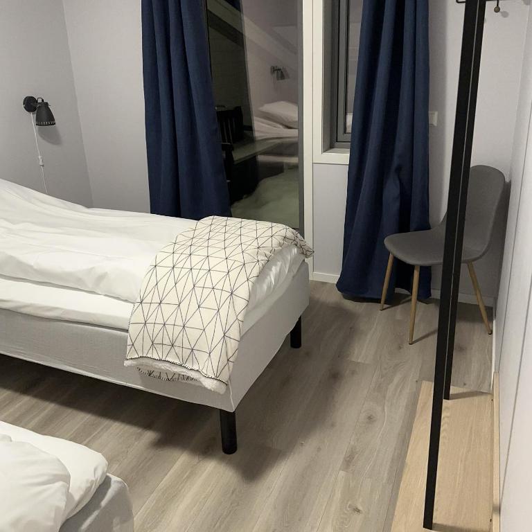 Postel nebo postele na pokoji v ubytování Lofoten Overnatting - Leknes