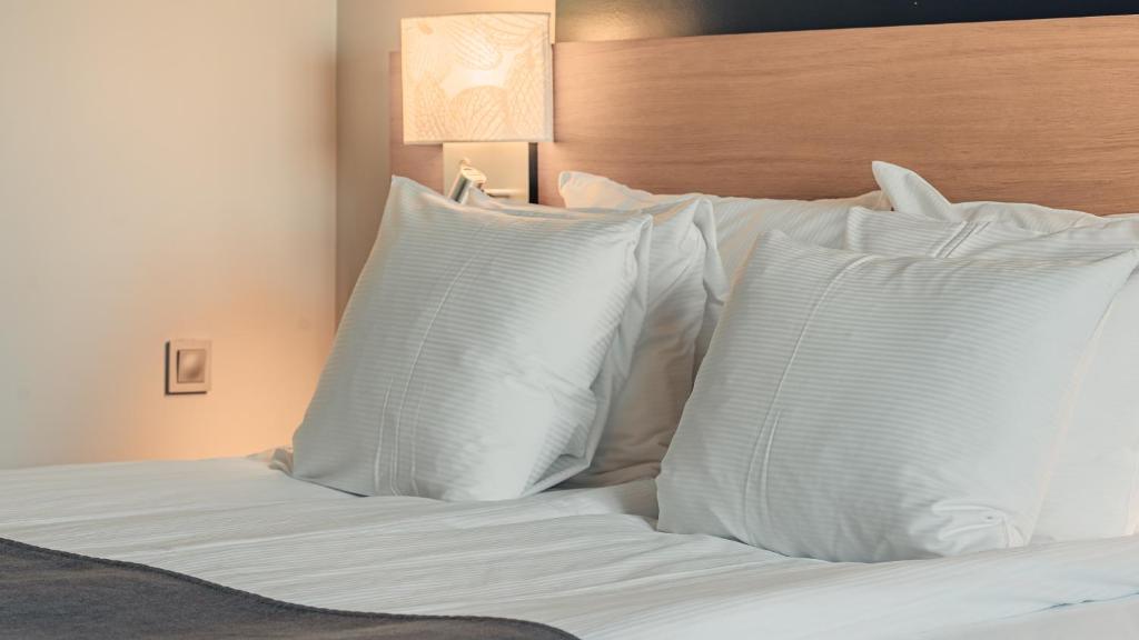 Postel nebo postele na pokoji v ubytování Quality Hotel Waterfront