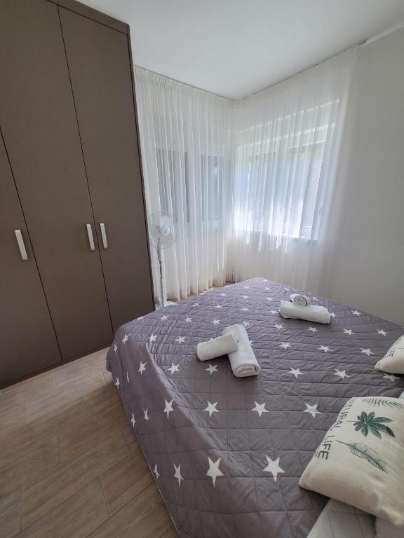 Postel nebo postele na pokoji v ubytování Apartment Toth - Rtina Benići